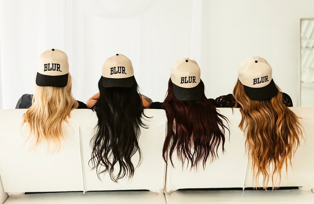 Four guests with custom hair color and extensions wearing Blur. caps at the Oklahoma City salon